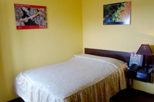 Cama ou camas em um quarto em Hostal Iquique