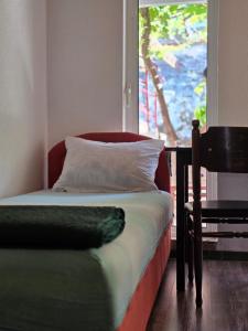 Postel nebo postele na pokoji v ubytování Bozovic Apartments I