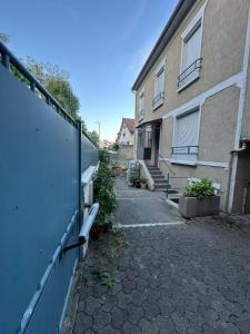 an empty alley in front of a building at Casa Thiaza - Close to Orly - 6 people - 3 bedrooms in Thiais +18 photos