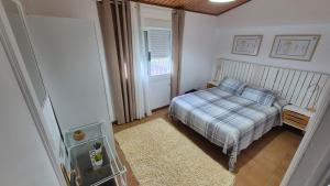 Кровать или кровати в номере Casa en entorno rural cerca de la playa