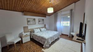 Кровать или кровати в номере Casa en entorno rural cerca de la playa