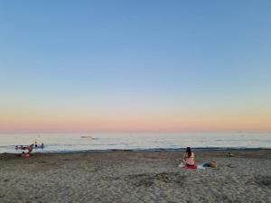 a group of people on a beach near the water at Welcome to Marie's in Frontignan +2 photos