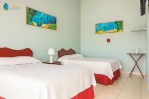 Voodi või voodid majutusasutuse Hotel Divisamar by LHR toas