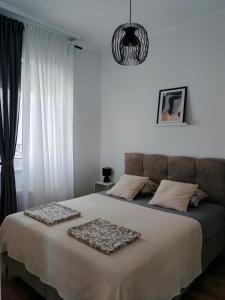 Katil atau katil-katil dalam bilik di Apartman Rakanović