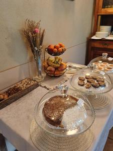 a table with two plates of food on it at B&B La Quercia in Moncalvo