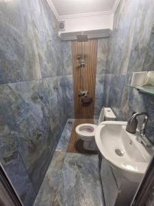 a bathroom with a sink and a toilet at Mihalkat Old Town in Sozopol