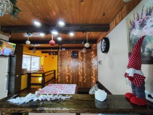 a room with a santa hat on a table at Карпатський куточок in Slavske