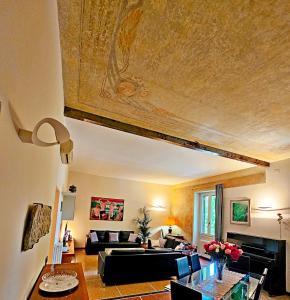a living room with a couch and a table at Vatican Prestige - Meospiti Cesare Exclusive in Rome