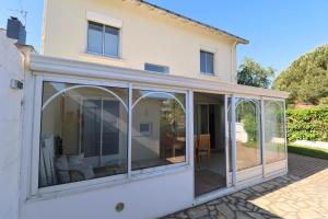 an extension to a house with sliding glass doors at L'Escale by Tranquil at Home in Pornichet