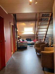 Ruang duduk di La pause Pom' de Pain appartement