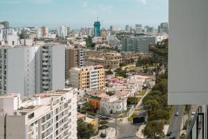 an aerial view of a city with tall buildings at Modern 3BR 2BA Apt Gym and Parking Near Real Plaza, UP and Trendy Cafés in Lima