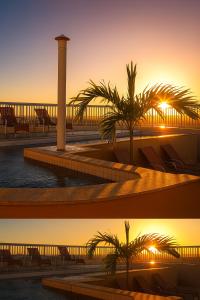 two pictures of a resort with palm trees and the sunset at Green Hotéis in Cabo Frio