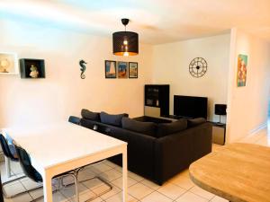 a living room with a couch and a table at Résidence Villa Antoinette - maeva Home - Appartement 3 pièces 4 personnes - Exclusive MAE-6573 in Grimaud