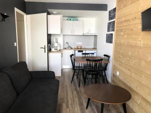 a living room with a couch and a table at Appartement 2 Pièces 4 Personnes - Rénové MAE-9783 in Germ