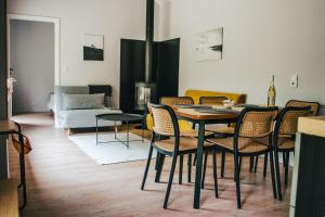 a dining room with a table and chairs at Kalma Roztocze in Tereszpol Zaorenda