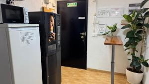 a door with a picture of a woman on it at PENSIÓN ROSA in Benidorm