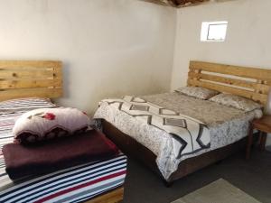 Ένα ή περισσότερα κρεβάτια σε δωμάτιο στο Ha Ramabanta Riverside