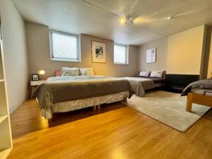 a large bedroom with two beds and a couch at Royal Casino Namur Balcony in Namur