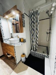 a bathroom with a sink and a tub and a shower at La Maison de Faustin in Saint-Guilhem-le-Désert +29 photos