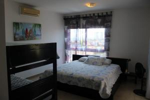 a bedroom with a bed and a window at Apartmento en Playa Blanca Rio Hato in Río Hato +43 photos