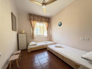 Postel nebo postele na pokoji v ubytování Villa Elisa