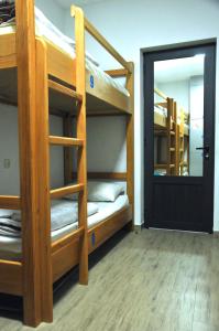 Postelja oz. postelje v sobi nastanitve MGA Hostel & Tours