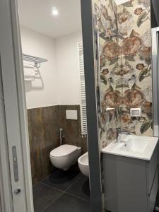 a bathroom with a toilet and a sink at ANGELICA Luxury in Bologna