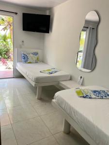 Postel nebo postele na pokoji v ubytování Hotel Heliopolis