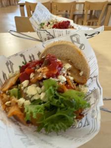a plate of food with a salad and a sandwich at Hotelli Unelma in Kullaa +43 photos
