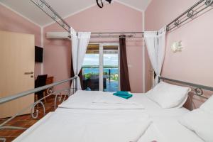 Postel nebo postele na pokoji v ubytování House Davorka
