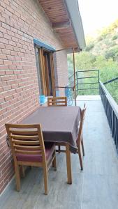 a table and two chairs on a patio at Ahsen pansiyon in Selçuk