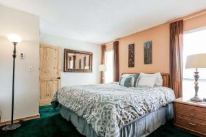 a bedroom with a bed and a window at Family Fun Condo - 2bdrm with Loft Perfect for 6 in Fraser