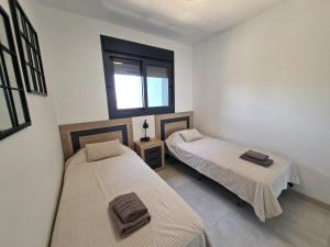 Postel nebo postele na pokoji v ubytování Sunset Waves excellent apartment Benidorm
