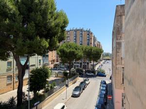 a view of a city street with cars parked on the road at RM's Guesthouse in Brindisi