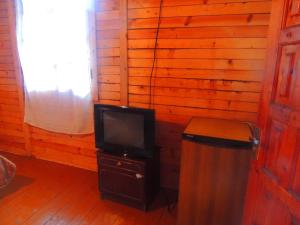 a television sitting on a stand in a room at Old City in Borjomi