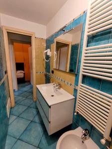 a bathroom with a sink and a toilet at Villetta Marina in Roseto degli Abruzzi +24 photos