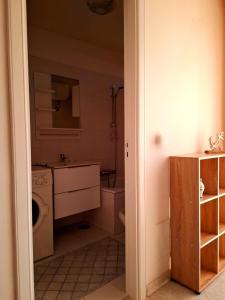 a bathroom with a sink and a toilet and a sink at La maison del pescatore in Cetara +23 photos