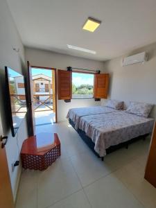 Ένα ή περισσότερα κρεβάτια σε δωμάτιο στο CASA OÁSIS ATINS duplex no cond village Buna Atins