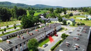 an aerial view of a town with buildings and a street at Apartament Wysoka 580 z prywatną łazienką in Bielawa