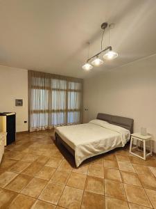 a bedroom with a large bed and a table at Rocky House in Ripa Teatina +43 photos
