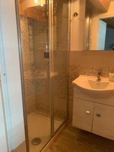 a bathroom with a shower and a sink at U muragliuni 1 in Lascari