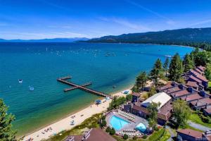 an aerial view of a beach with a pier at Lakeland Village #105 in South Lake Tahoe