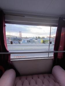 a window in a bus looking out at an airport at Ap COP 30 NA AUGUSTO MONTENEGRO in Belém