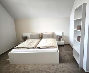 Postel nebo postele na pokoji v ubytování Apartmán
