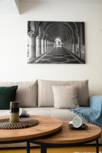 a living room with a table and a couch at Emanuel Apartments in Strumica