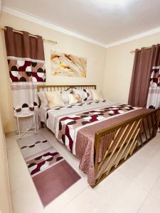 a bedroom with a bed with a cow patterned blanket at Apartamento Paseo del Este in Mendoza +17 photos