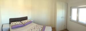 Postel nebo postele na pokoji v ubytování Apartments Šuker