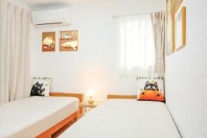 A bed or beds in a room at 夢圓-4LDK貸切-浴室2-p4台-静かな環境で家族やグループに最適な宿