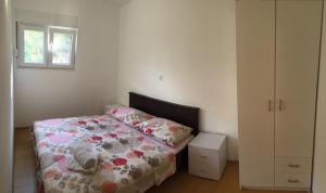 Postel nebo postele na pokoji v ubytování Apartments Šuker