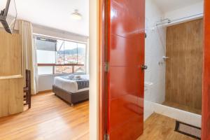 Postel nebo postele na pokoji v ubytování Cusco Hostal Qolla Wasi-II